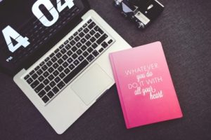 8-1-kaboompics-com_pink-notebook-with-sentence-and-apple-macbook